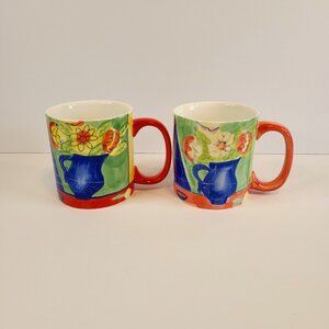 Two Eddie Bauer coffee mugs with floral design